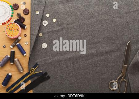 Collage of Sewing Materials and Fabric on a Wooden Table for Crafting and Design Projects Stock Photo