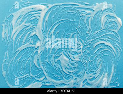 Collection of Soap Bubbles Creating a Unique Pattern on a Blue Background Surface Stock Photo