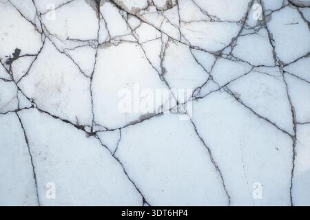 White marble surface with black veins and cracks Stock Photo