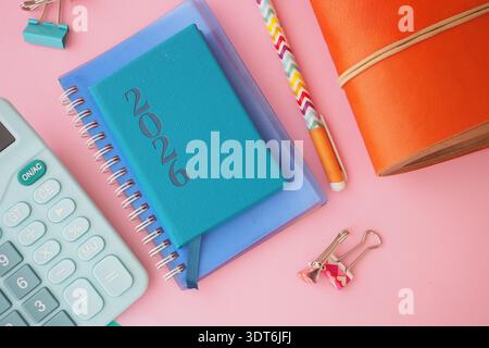 New planner and study tools arranged on a pink surface Stock Photo