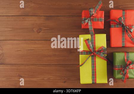 Collection of Colorful Gift Boxes Arranged on Wooden Surface for Festive Occasion Stock Photo