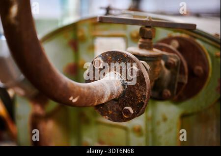 Rusty valve with history, conveying the passage of time in an industrial setting filled with nostalgia and adventure Stock Photo