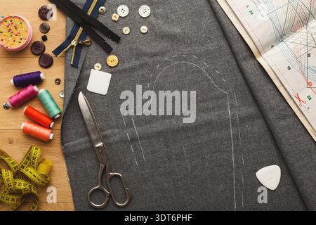 Collage of Sewing Materials and Tools on a Craft Table With Fabric and Patterns Stock Photo