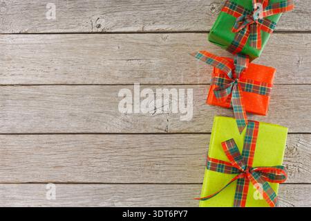 Colorful Collection of Gift Boxes Arranged on Wooden Surface for Special Occasion Stock Photo