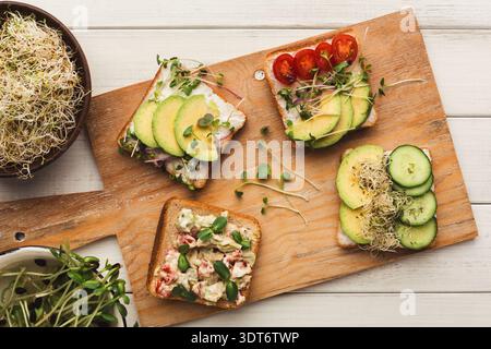 Various Sandwiches Arranged on a Cutting Board in a Simple Presentation for a Light Meal Stock Photo