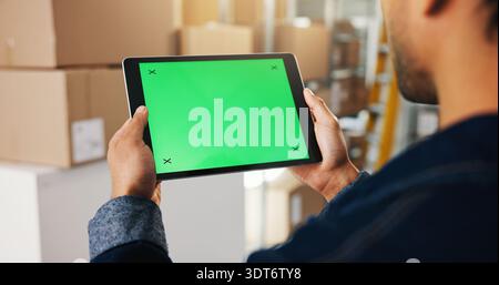 Logistics, green screen or hands in warehouse with tablet, mockup or inventory management in ux design. Distribution, man or supplier in depot with Stock Photo