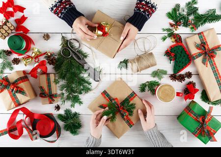 Gift Wrapping Session During Holiday Preparation With Various Materials and Decorations Stock Photo
