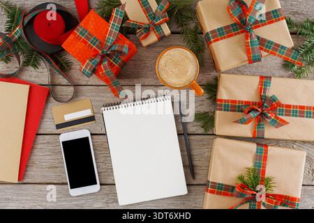Gift Wrapping Supplies and Decorations Arranged on a Wooden Table During the Holiday Season Stock Photo