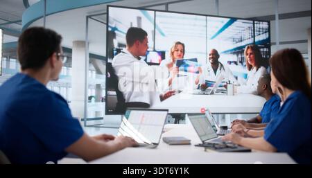 Diverse Medical Team Collaborating On Webinar About Hospital Procedures Stock Photo