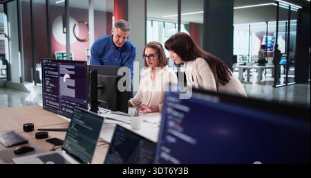 Dedicated Team Of Programmers Collaborates On New Website Design Project Stock Photo