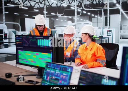 Engineer Monitoring Construction Plant With SCADA Software On Desktop Computer. Stock Photo