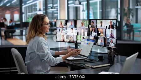 Virtual Office Conference: Woman Learning Business Via Online Call Stock Photo