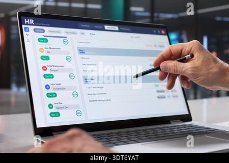 Corporate HR Executive Using Software To Schedule Interviews On Laptop. Stock Photo
