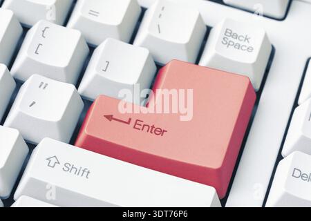 Keyboard with red Enter key. Close up view Stock Photo