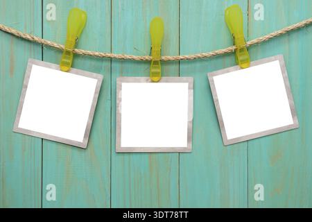 Empty picture frames hanging on rope Stock Photo