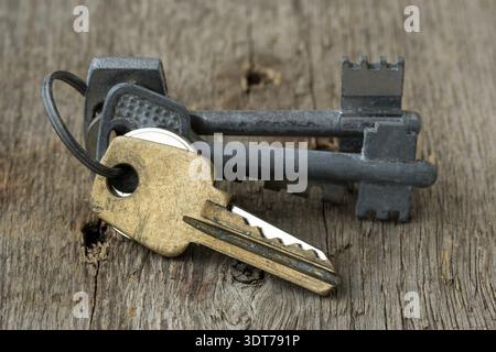 Bunch of different old keys on wooden surface Stock Photo