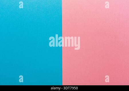 Blue and Pink Paper Divided in the Center Creates a Clear Visual Contrast in a Simple Composition Stock Photo