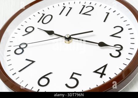 Dial wall clock in a classic style, close-up view Stock Photo