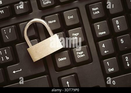 Security lock on black computer keyboard - computer security concept Stock Photo