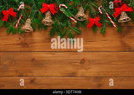 Collage of Christmas Decorations With Bells and Ribbons on Wooden Background Stock Photo