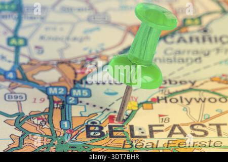 Green pushpin on the Northern Ireland map showing Belfast location Stock Photo