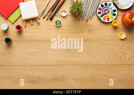 Collection of Art Supplies on a Wooden Table for a Creative Activity at Home Stock Photo