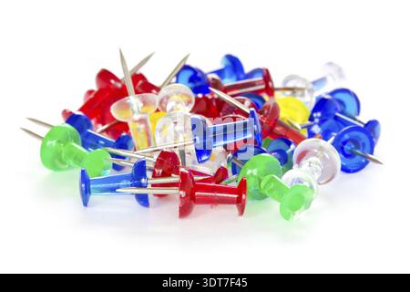 Pile of colorful pushpins on a white background Stock Photo