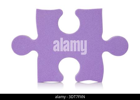 Purple puzzle piece over a white background Stock Photo