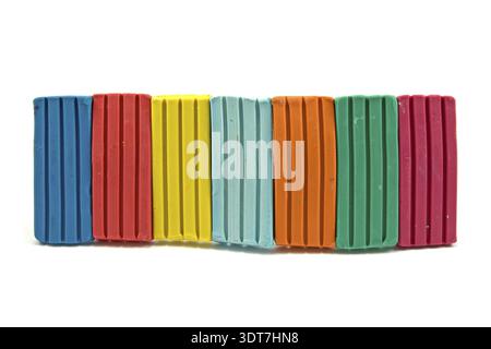 Row of colorful plasticine on white background Stock Photo