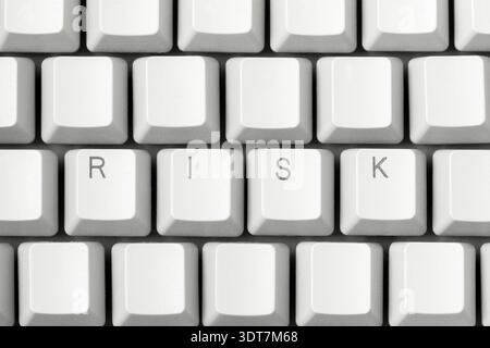 Risk lettering on white key on computer keyboard. Risk concept idea Stock Photo