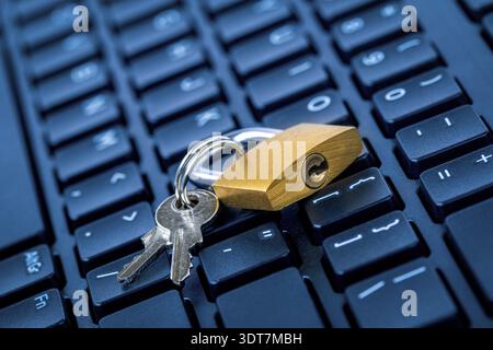 Computer security concept. Locked padlock on laptop keyboard. Security lock on computer keyboard - computer protection concept Stock Photo