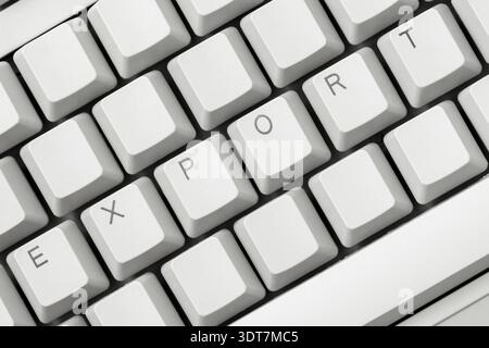 EXPORT write on the white computer keyboard. Import and export business Stock Photo