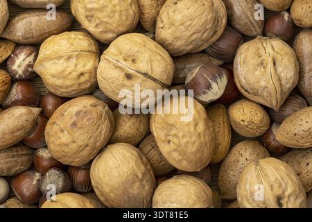 Assortment of nuts in shells. Selection of different types of nuts Stock Photo