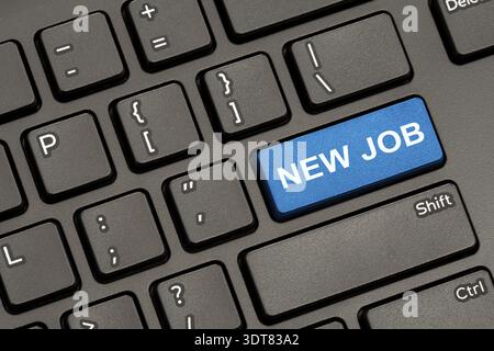 Modern Keyboard with Hot Key for New Job. New Job Concept: Computer Keyboard with New Job on Blue Enter Button Stock Photo