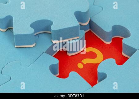 Missing piece of the puzzle with question mark. Set goals, tasks and ways of their solution and implementation. Business concept Stock Photo