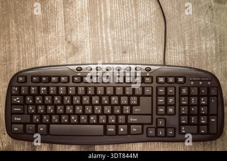 Black computer keyboard on the wooden desk Stock Photo