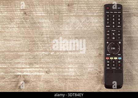 Tv remote controller on wooden background, copy-space Stock Photo