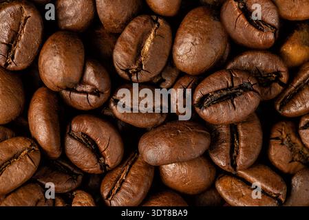Dense layer of premium coffee beans creating a seamless natural pattern for food Stock Photo