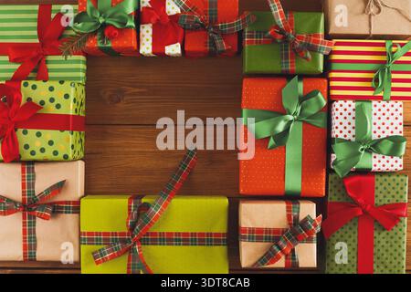 Colorful Gift Boxes Arranged in a Creative Pattern on a Wooden Surface During the Holiday Season Stock Photo