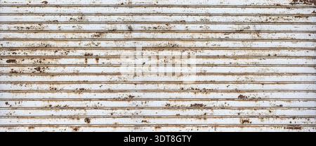 Rusty rolling metal shutter creating an old textured background Stock Photo