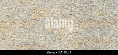 Rough stone surface showing natural sand and gray texture as abstract background Stock Photo