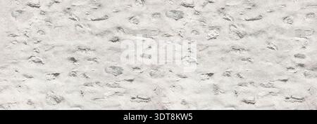 White painted stone wall showing old masonry and rugged surface texture Stock Photo
