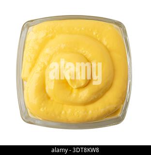 Creamy yellow mustard sauce in decorative white ceramic bowl ...