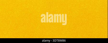 Golden yellow background showing a shimmering and textured pattern Stock Photo