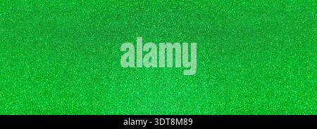 Green glitter creating a sparkling, vibrant, and festive background texture Stock Photo