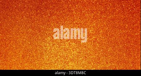 Orange gold glitter creating a shimmering, textured, festive background Stock Photo