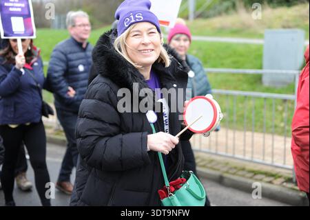 ALLOA, SCOTLAND – February 21st, 2026: Protester seen holding a small instrument during the march.  Protesters gather and march from Alloa Town Hall to Forth Valley College Alloa Campus during the "March for Alloa Campus" rally. The event, supported by EIS (Educational Institute of Scotland), GMB, and UNISON unions, opposes potential campus closure amid severe Scottish further education funding cuts and rising costs. Speakers included FVC Principal Kenny MacInnes, MSPs Keith Brown and Richard Leonard, MP Brian Leishman, and union representatives. Stock Photo