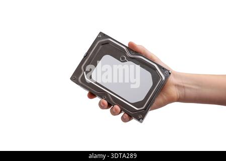 Hand holding closed hard disk drive against white background, computer storage device used for data backup and archive Stock Photo