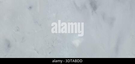 Light gray painted concrete wall texture with subtle brush strokes for minimal background Stock Photo