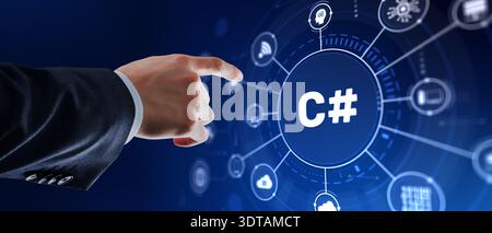 Software developer interacts with C# programming icon on modern IDE interface for application development. Stock Photo